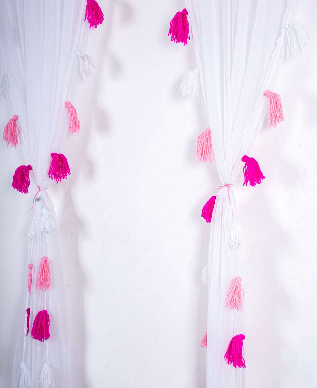 White Sheer Curtain with Pink and White Tassel Accents