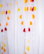 White Sheer Curtain with Yellow and Red Tassel Design