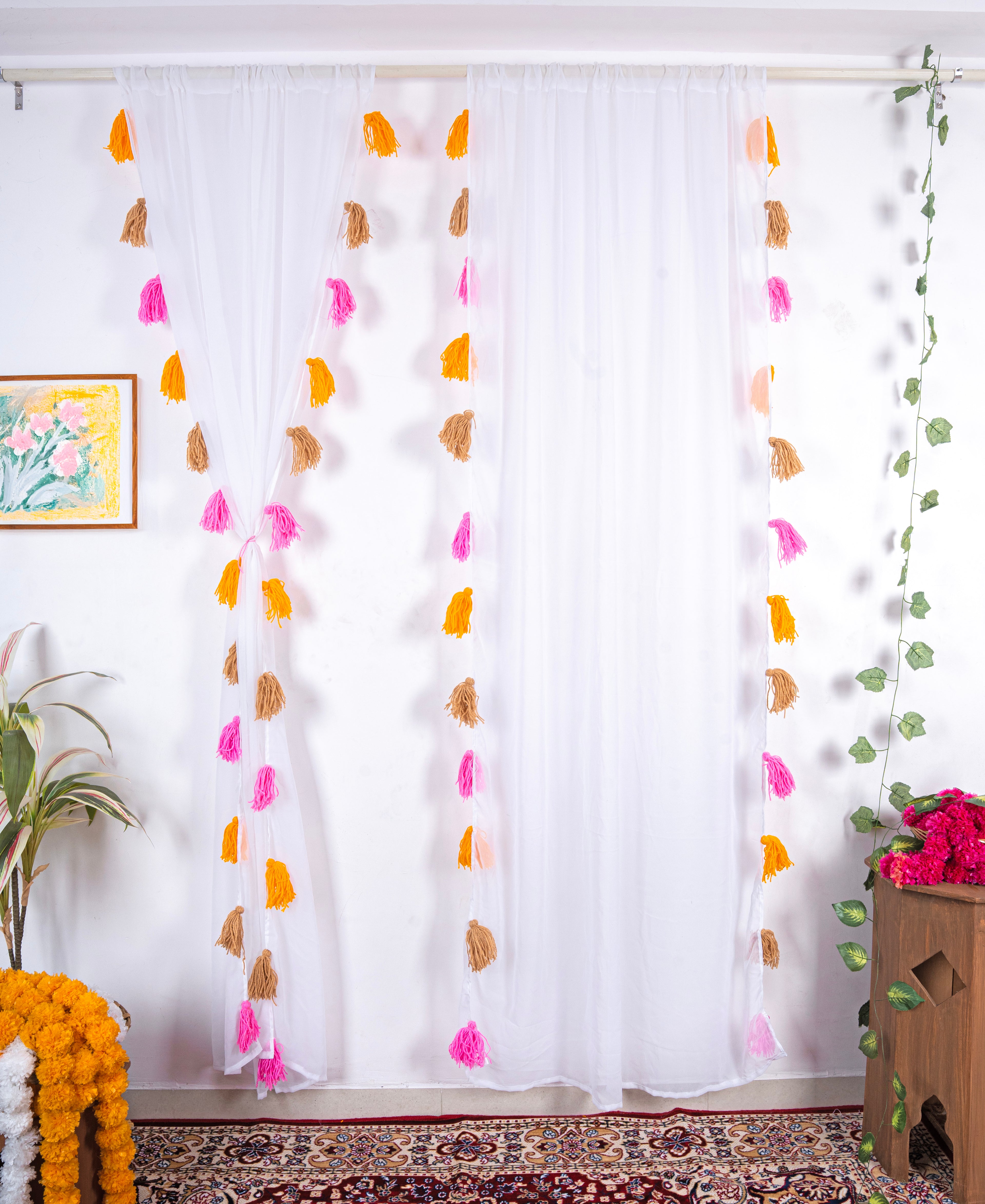 White Sheer Curtain with Pink, Orange, and Brown Tassel Rows