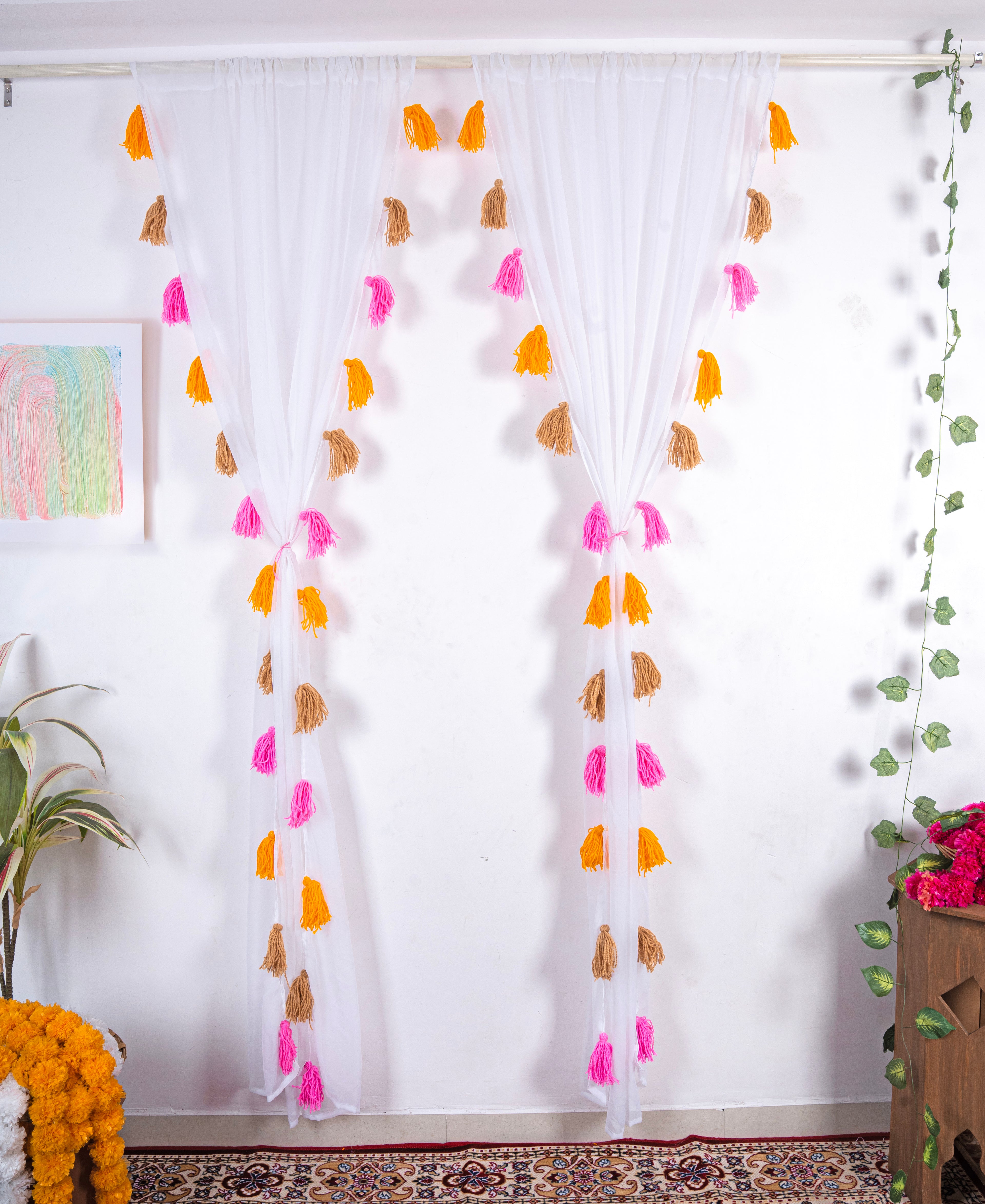White Sheer Curtain with Pink, Orange, and Brown Tassel Rows