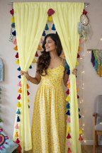 Soft Yellow Sheer Curtain with Multicolor Tassel Edges