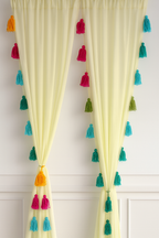 Sheer Yellow Window Curtain with Multicolor Tassel Detailing